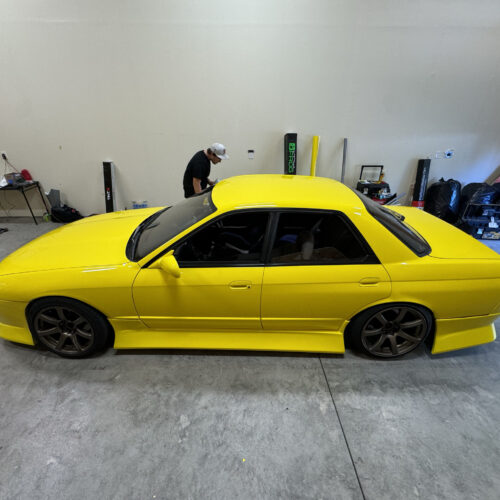 Nissan R32 Skyline Sedan - VinylFrog Yellow on Work Wheels T7R's.